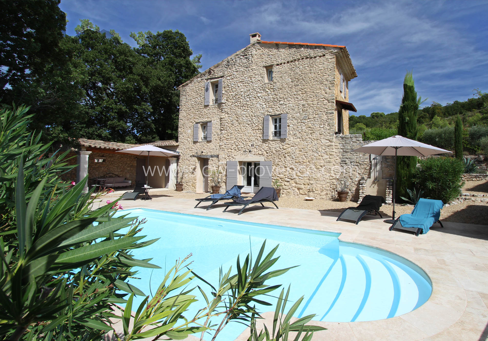 Swimming pool area overlooking the charming farmhouse