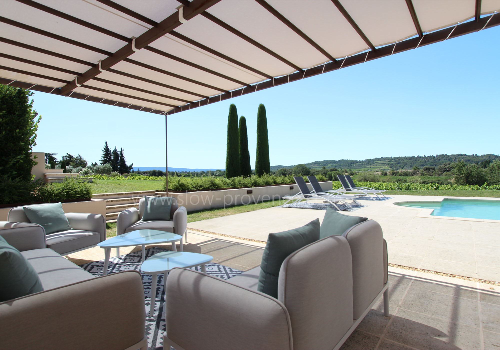Relaxing garden furniture at the edge of the vineyards