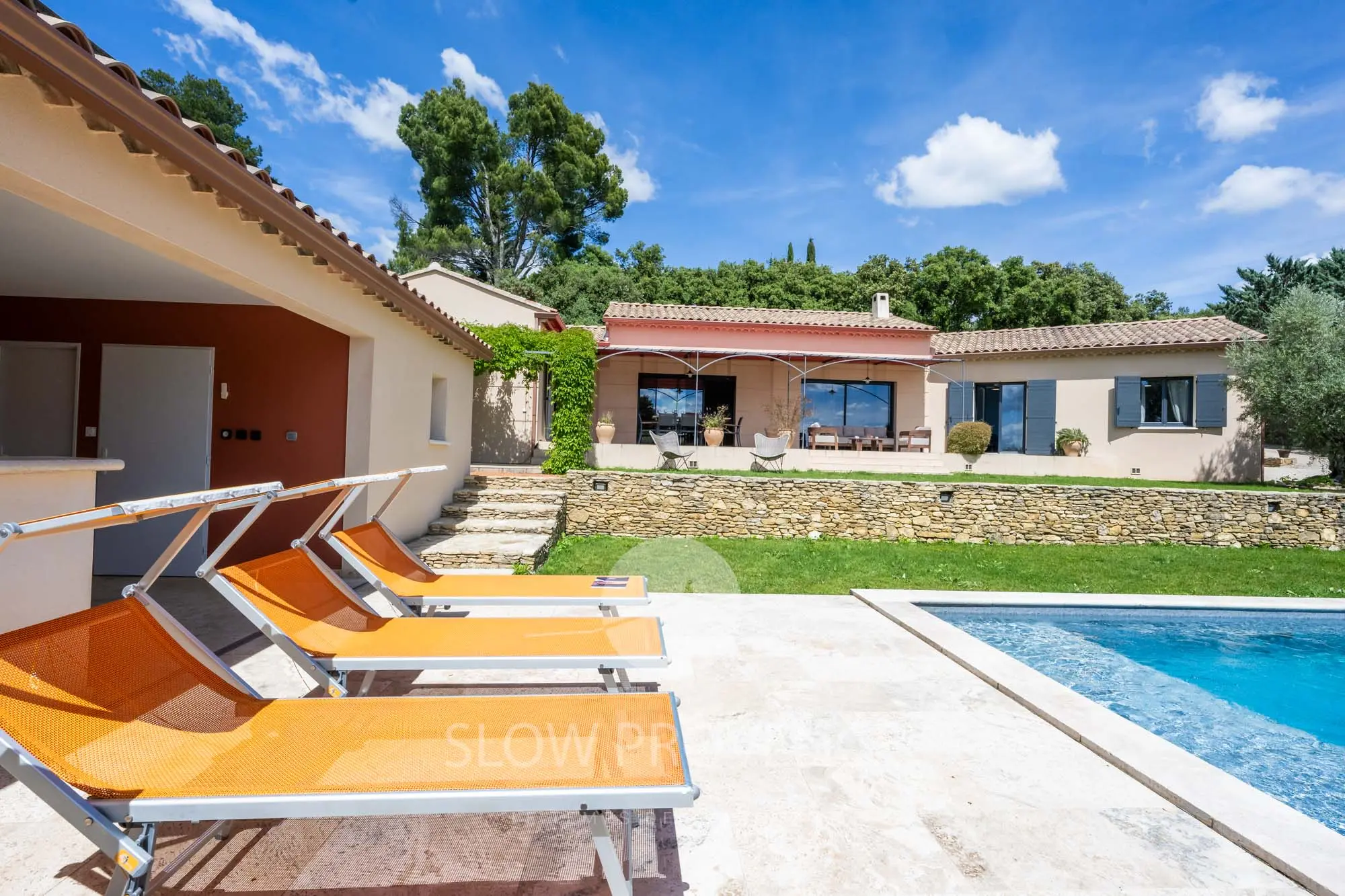 The swimming pool, below the house