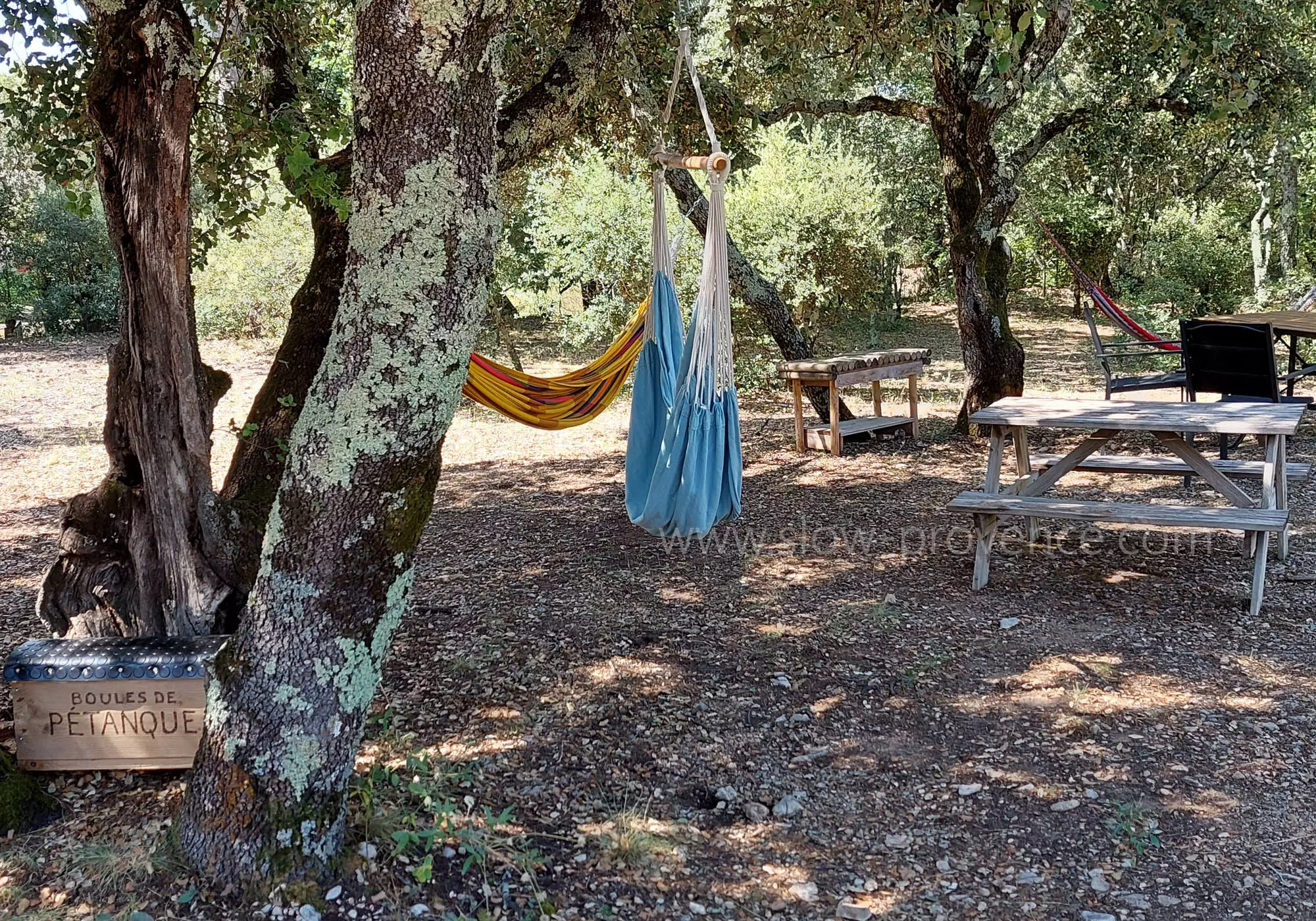 Relaxation area in the shade of oak trees