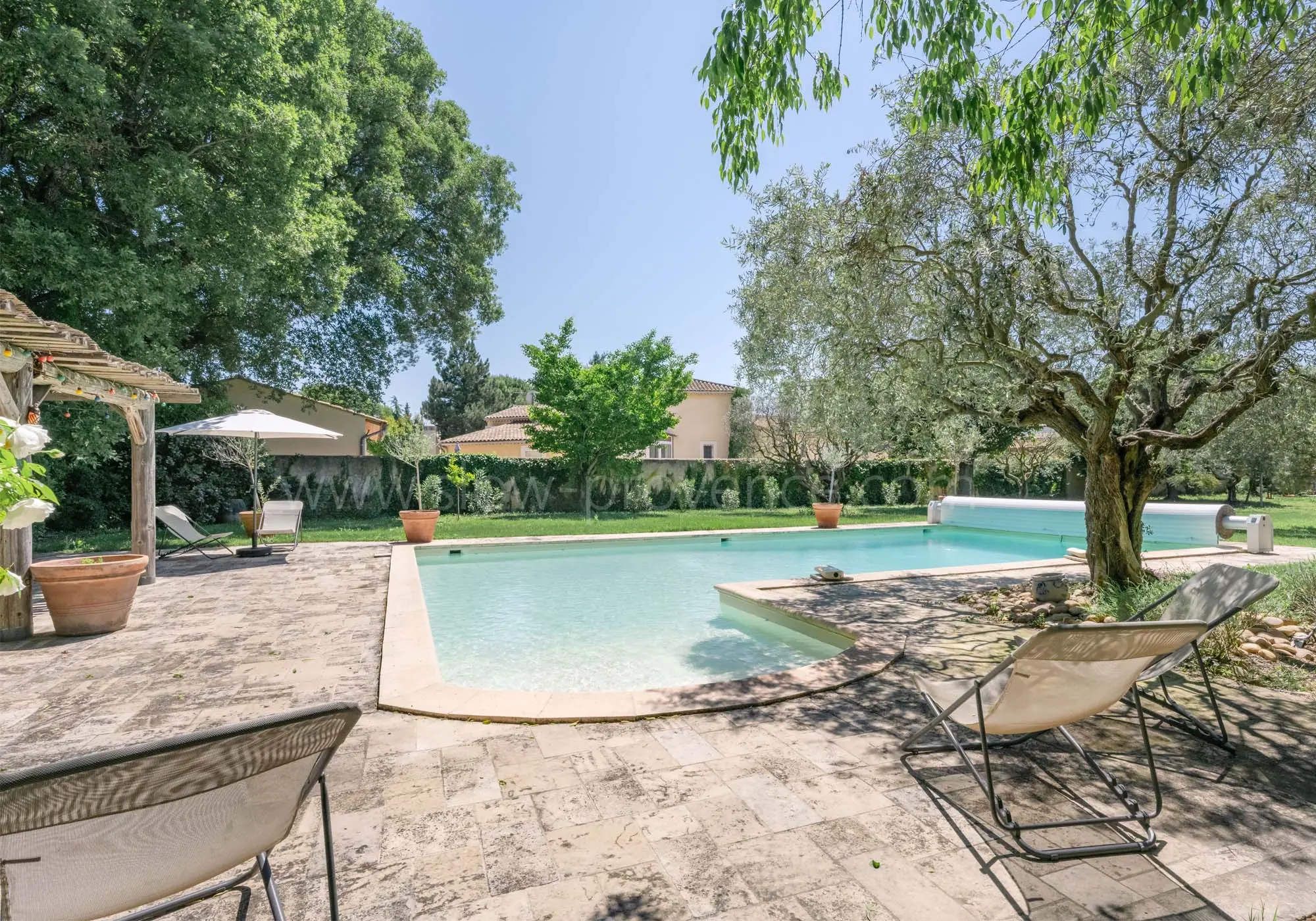 Shady, landscaped pool area