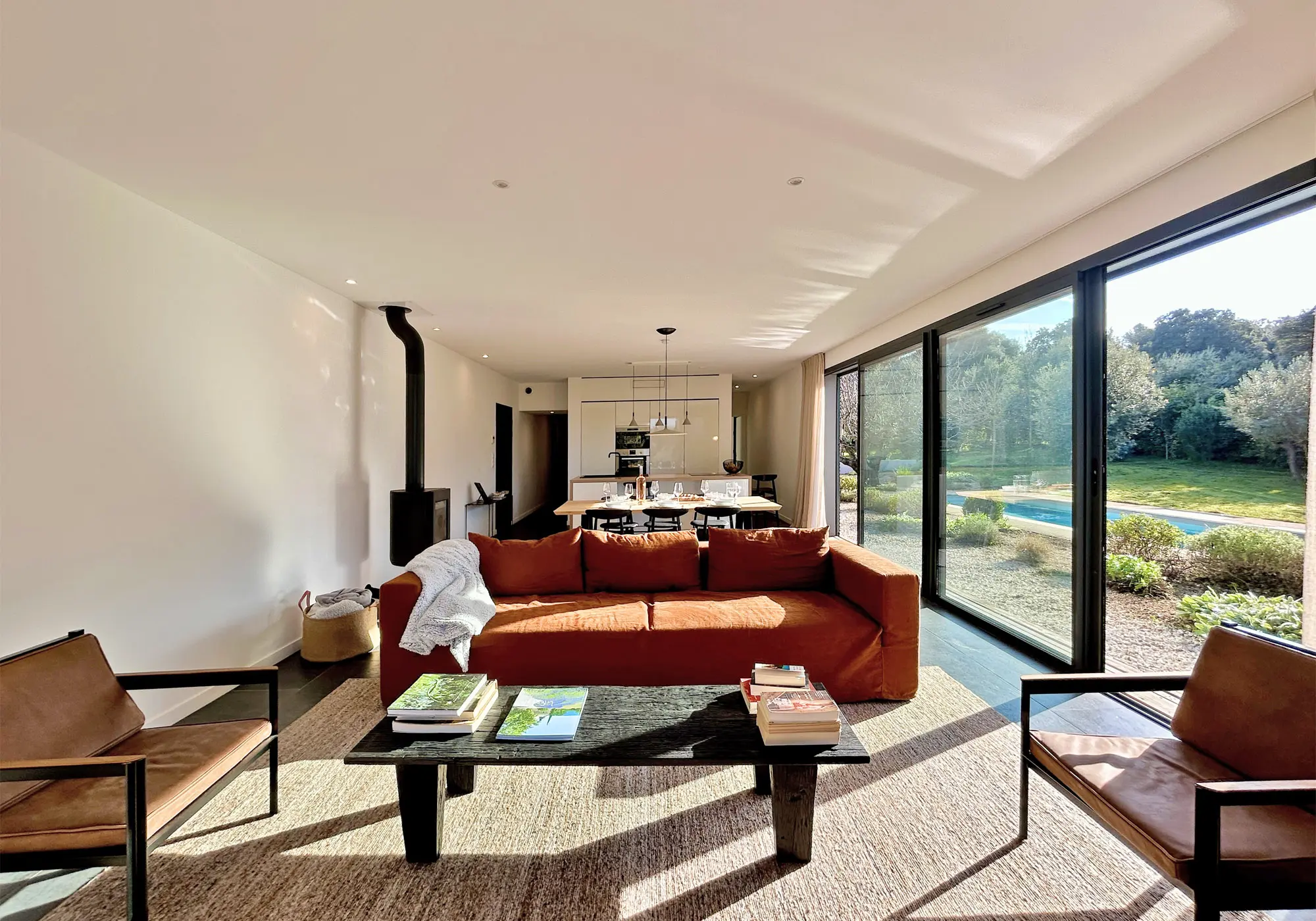 Large, bright living room opening onto the outside