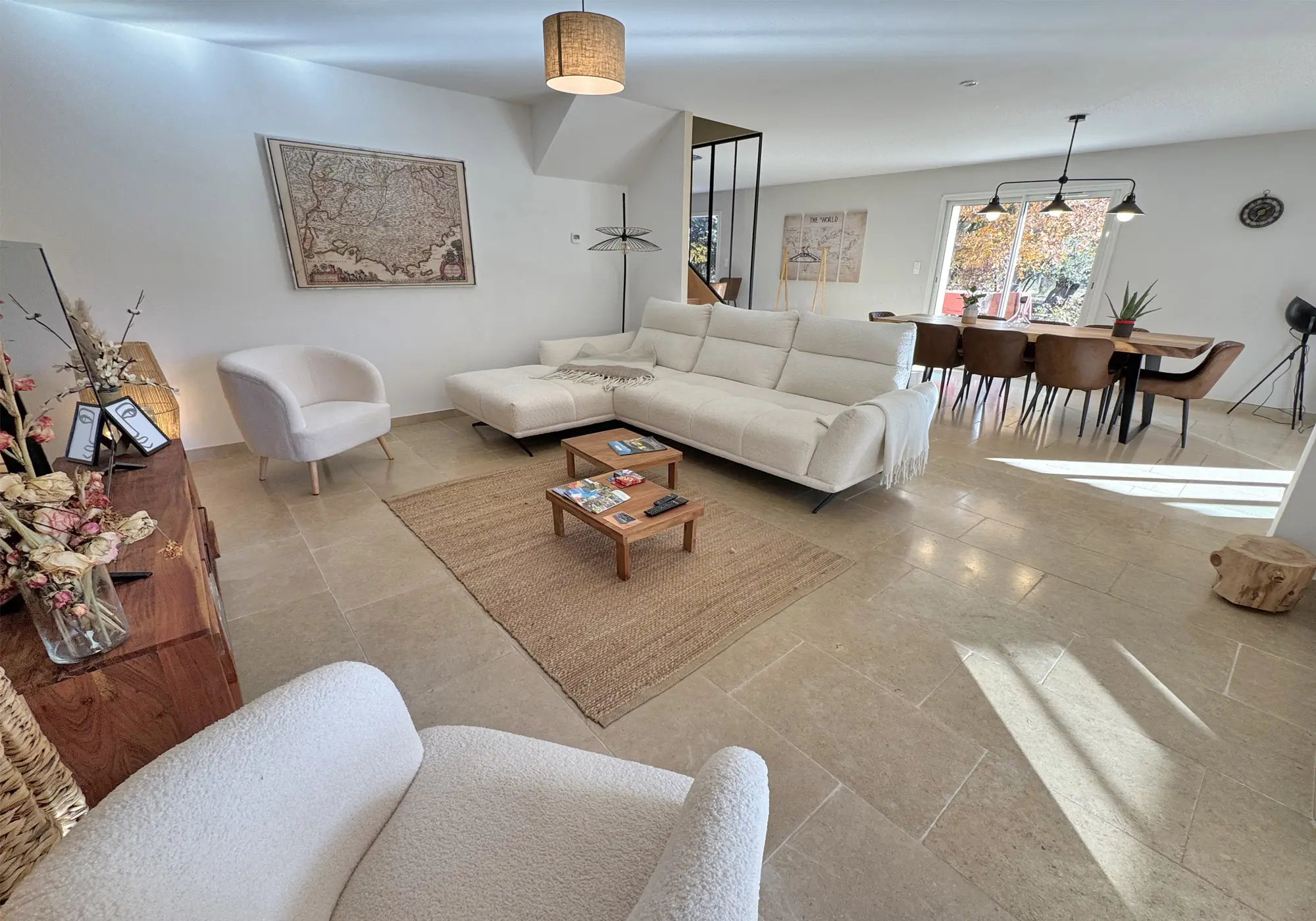 Open-plan living area with several openings to the outside