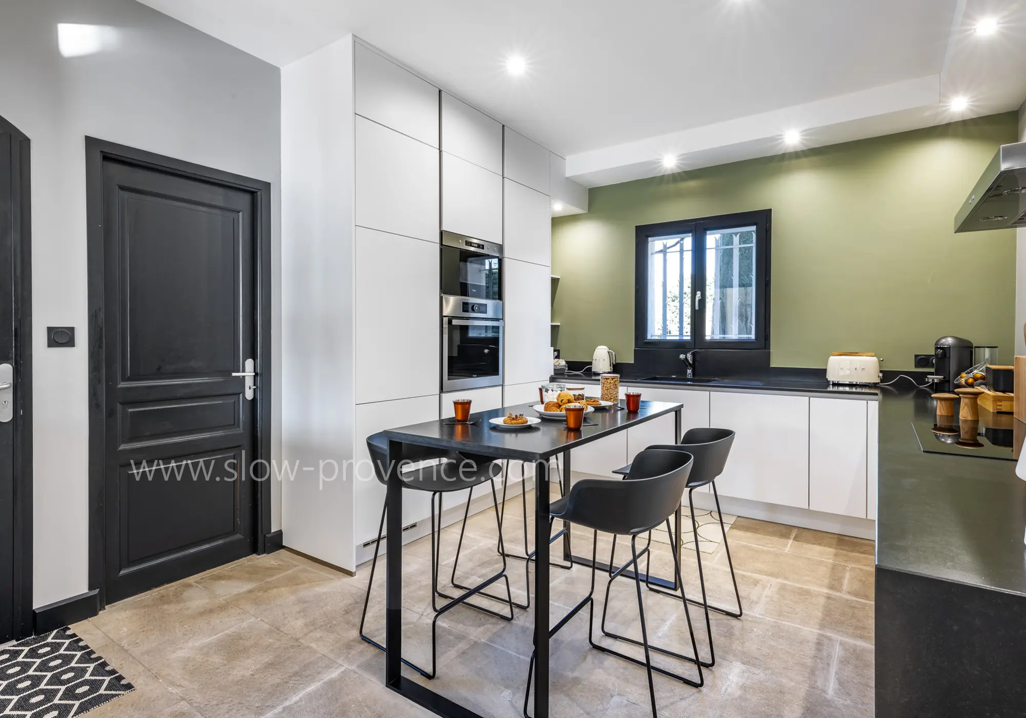 Entering through the bright kitchen