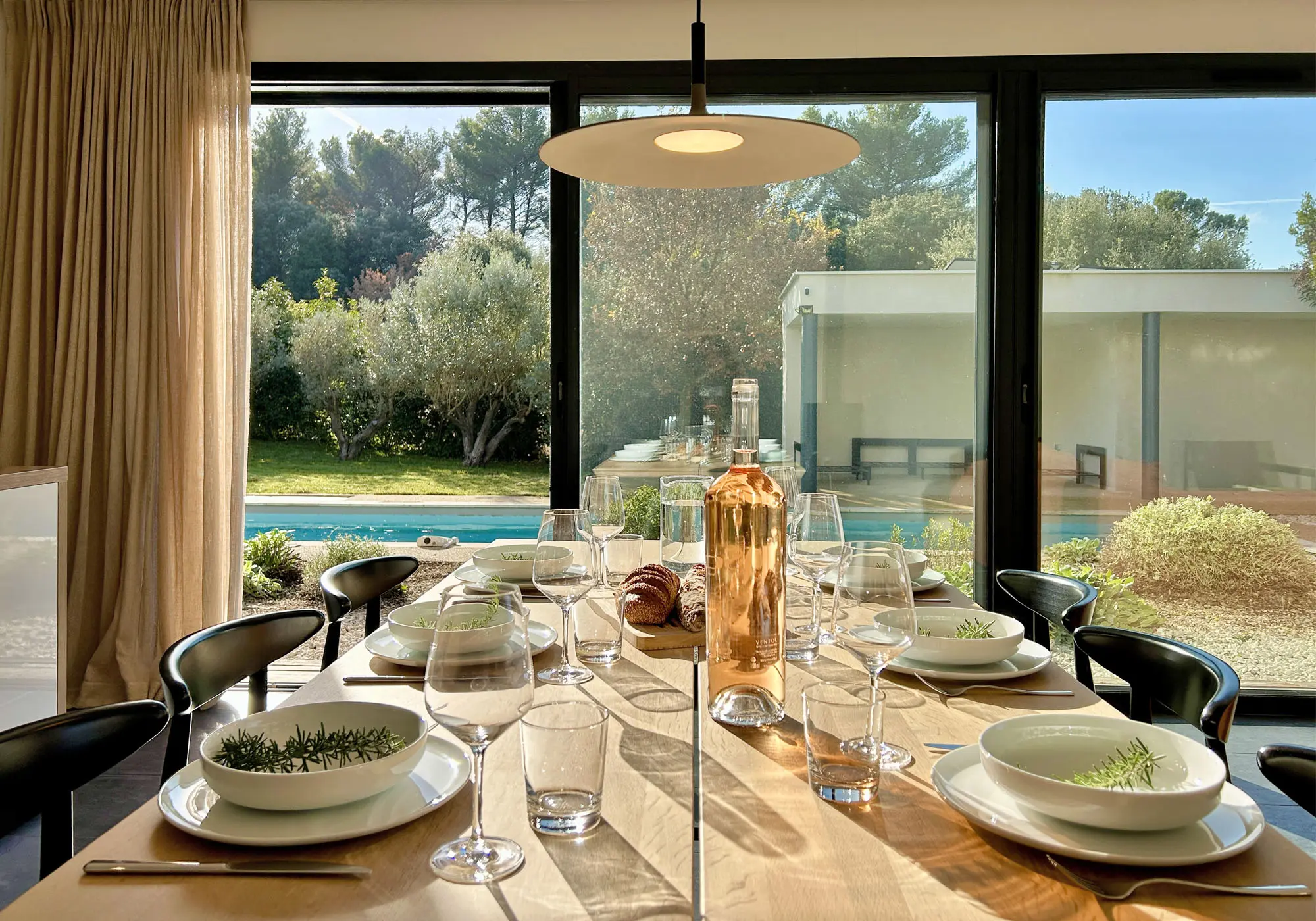 Dining room with views of the pool and garden