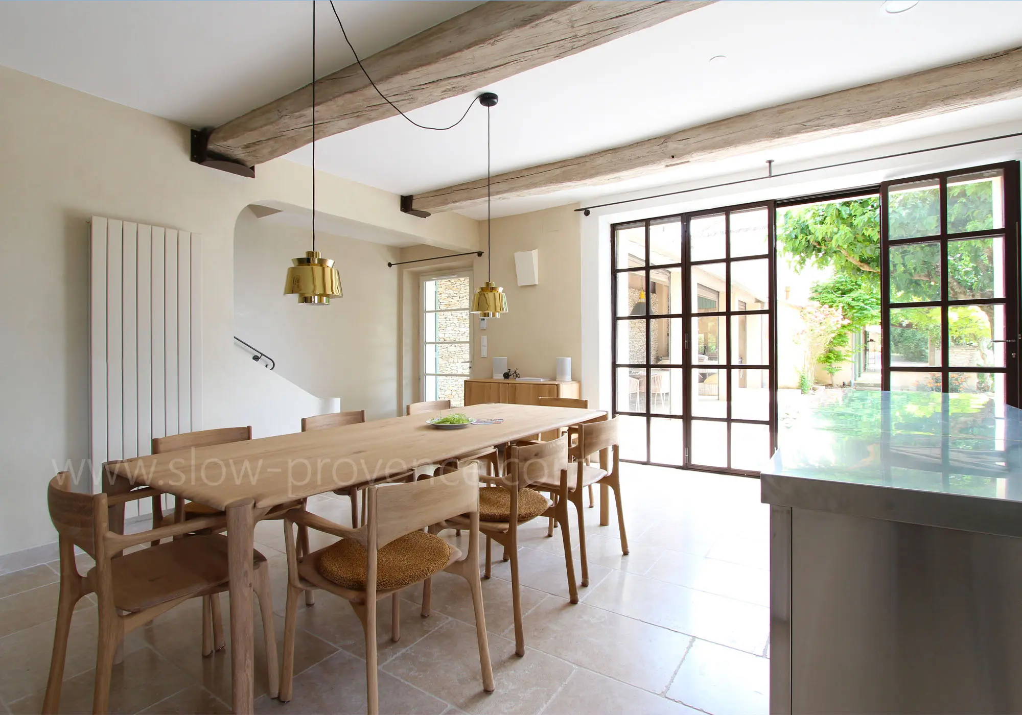 Dining room opening onto the kitchen and outdoors