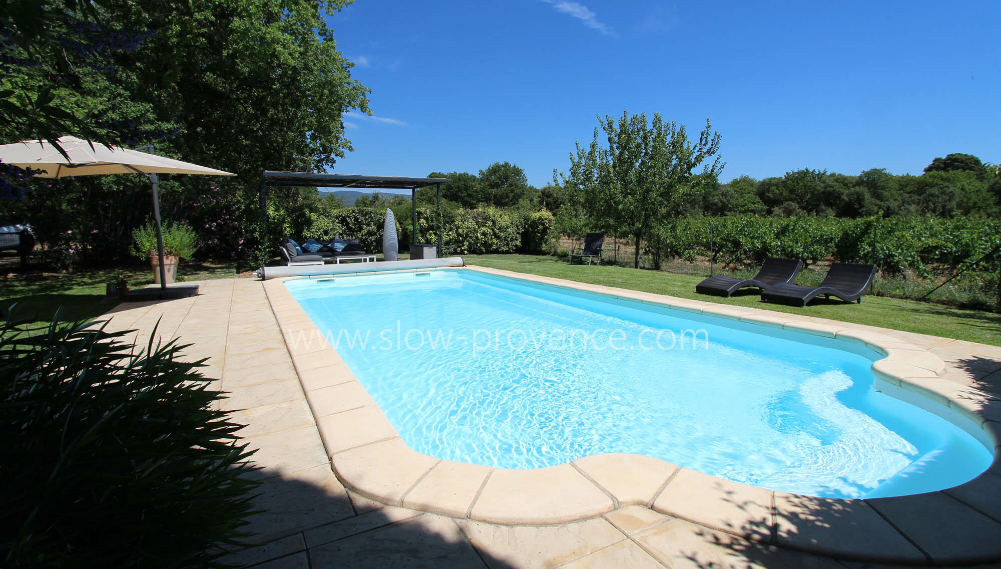 Pool heated by solar heating mats