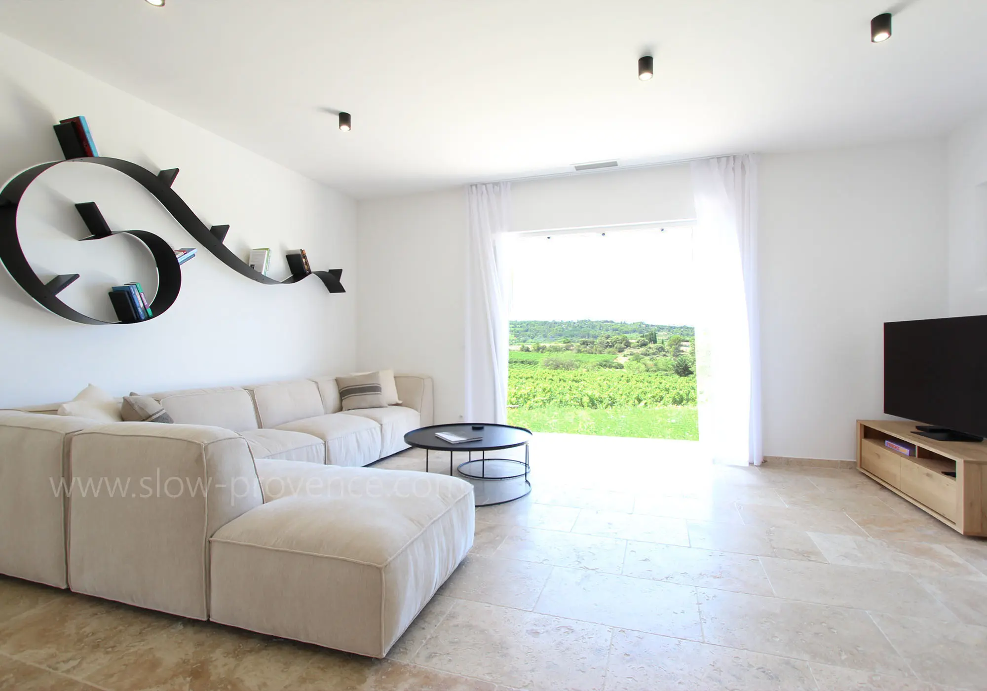 Large, bright living room opening onto the garden