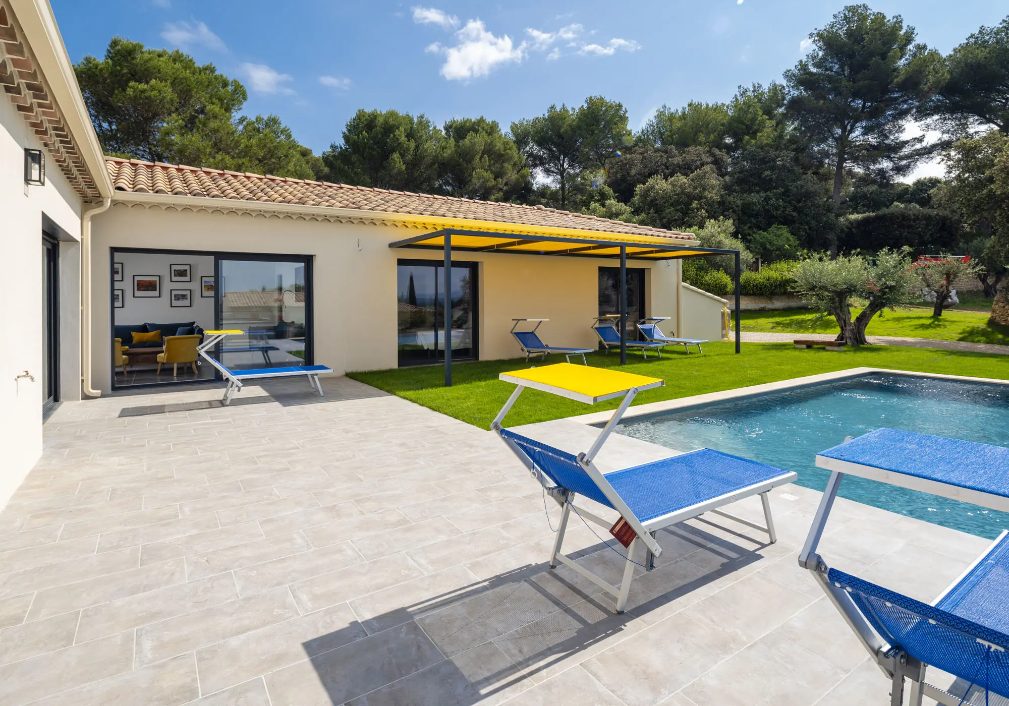 The terrace and the swimming pool, extending from the living room