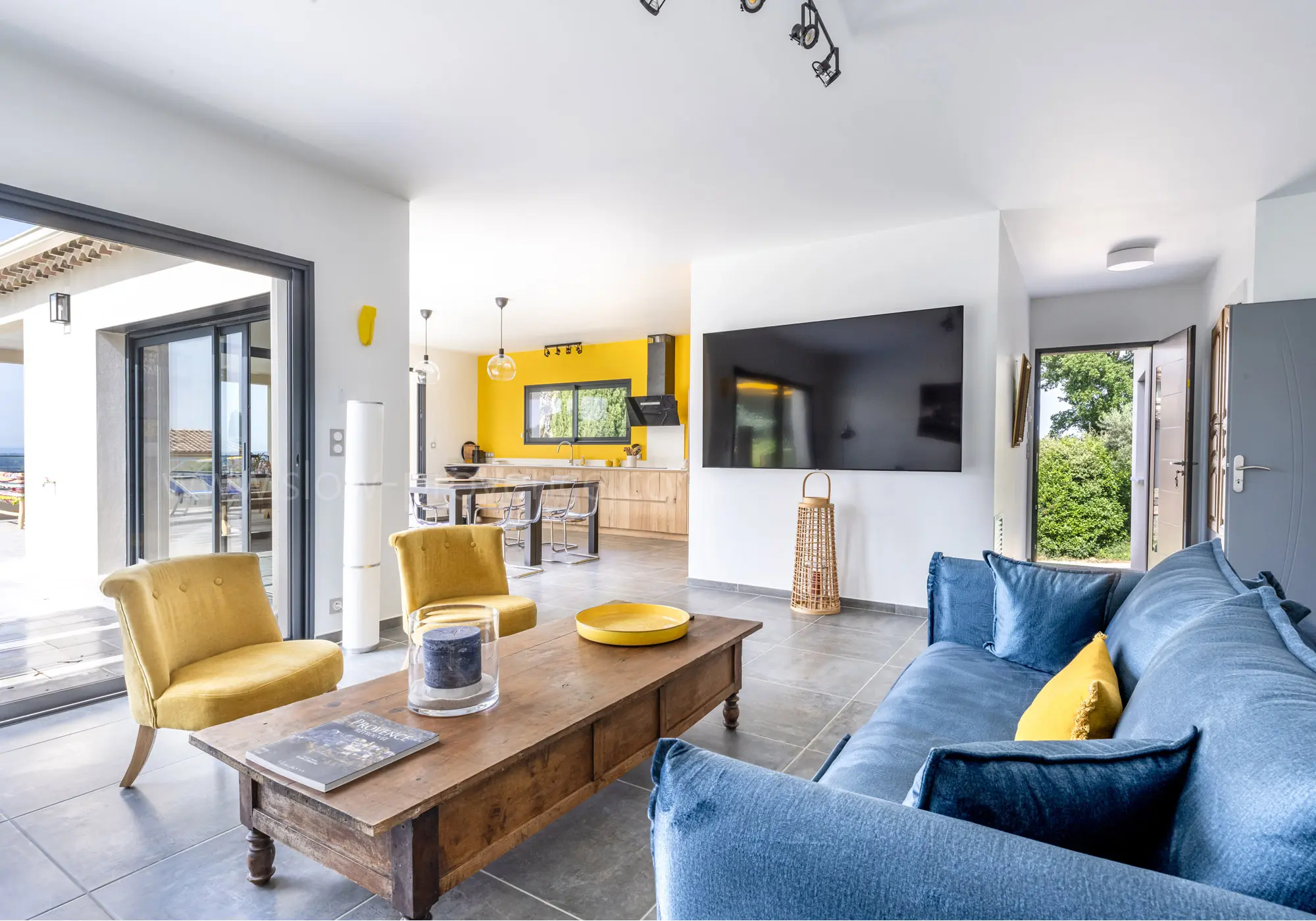 A spacious living room, opening onto the terrace